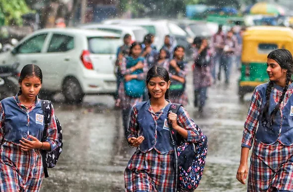 school-children-in-rain-145525618-16x9_0