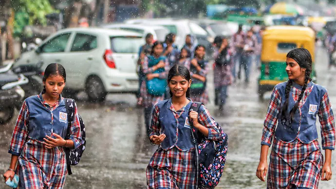 school-children-in-rain-145525618-16x9_0